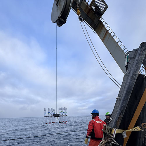 Scientists and crew deploy a sediment trap and the accompanying floats aboard the Research Vessel Roger Revelle picture 2