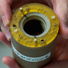 A specialized MRI coil and sample holder designed for imaging solid-state lithium-ion batteries. 